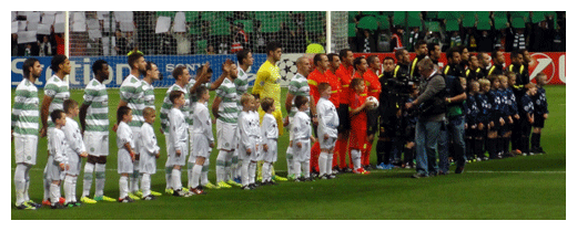 Teams line up at te start of the match